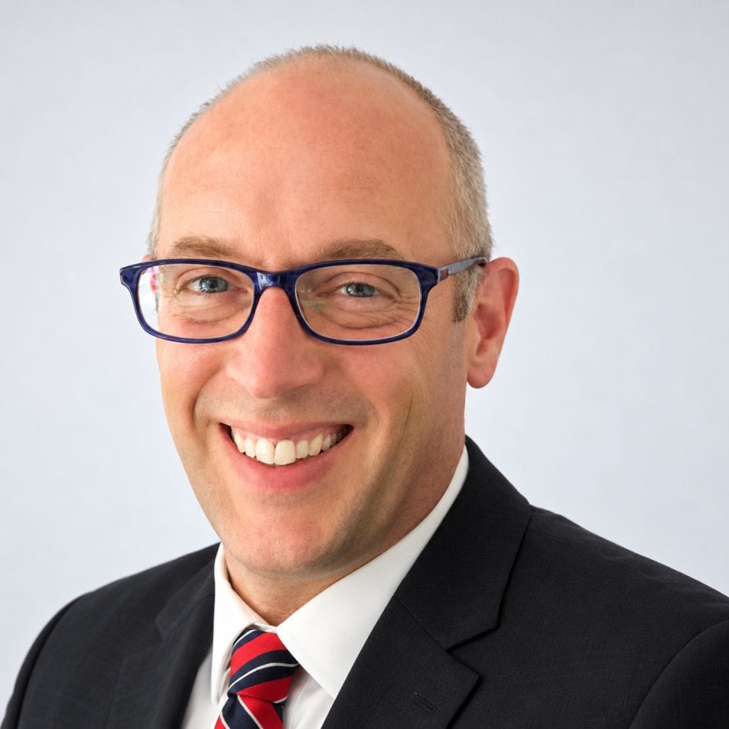 Friendly Corporate Headshot in Blue Glasses